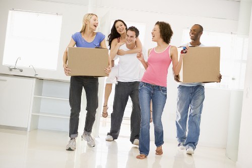 Moving van loading household items for a Bow property move