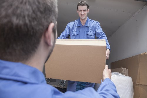 Careful moving team handling boxes during a Bow relocation